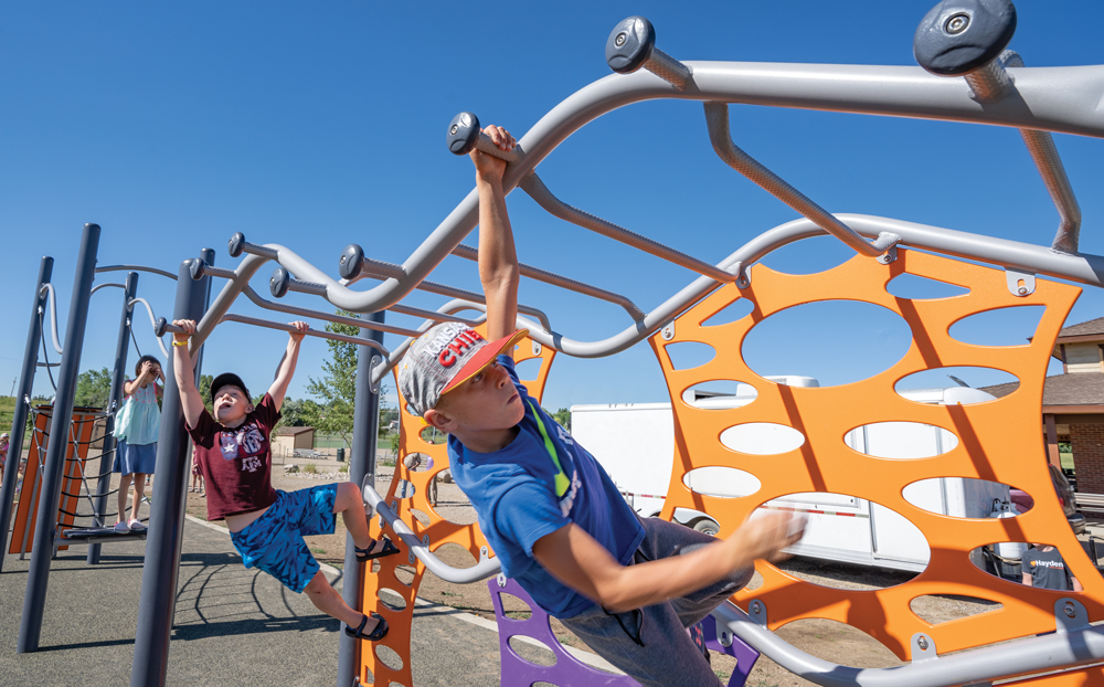 Children playing on Door Knob Jam playground equipment